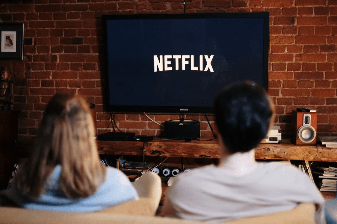 A couple watching Netflix on TV