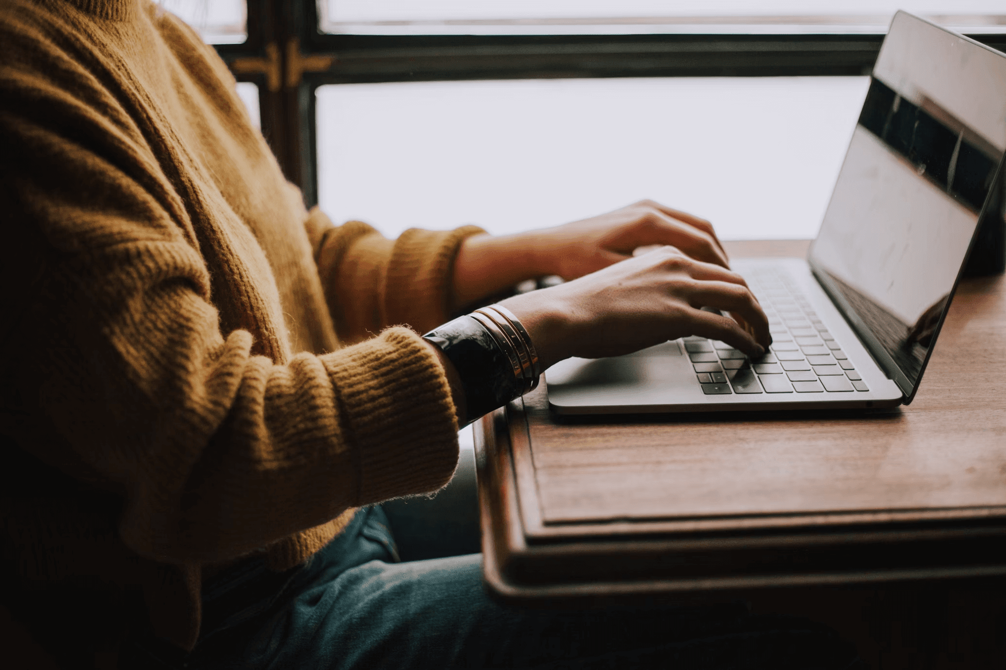 A person sitting in front of their laptop