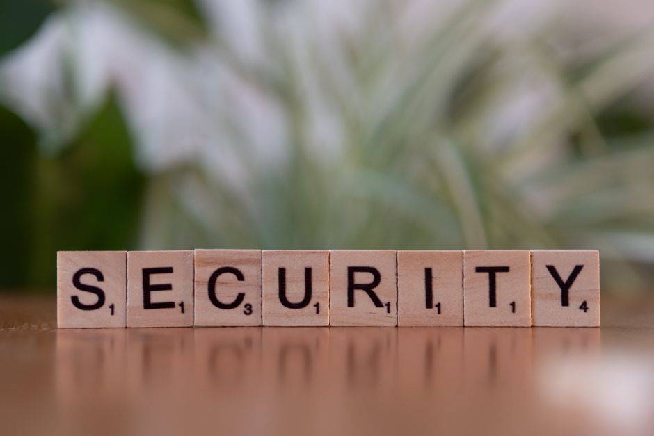 Wooden letter blocks spelling "SECURITY" illustrating online privacy and cybersecurity.